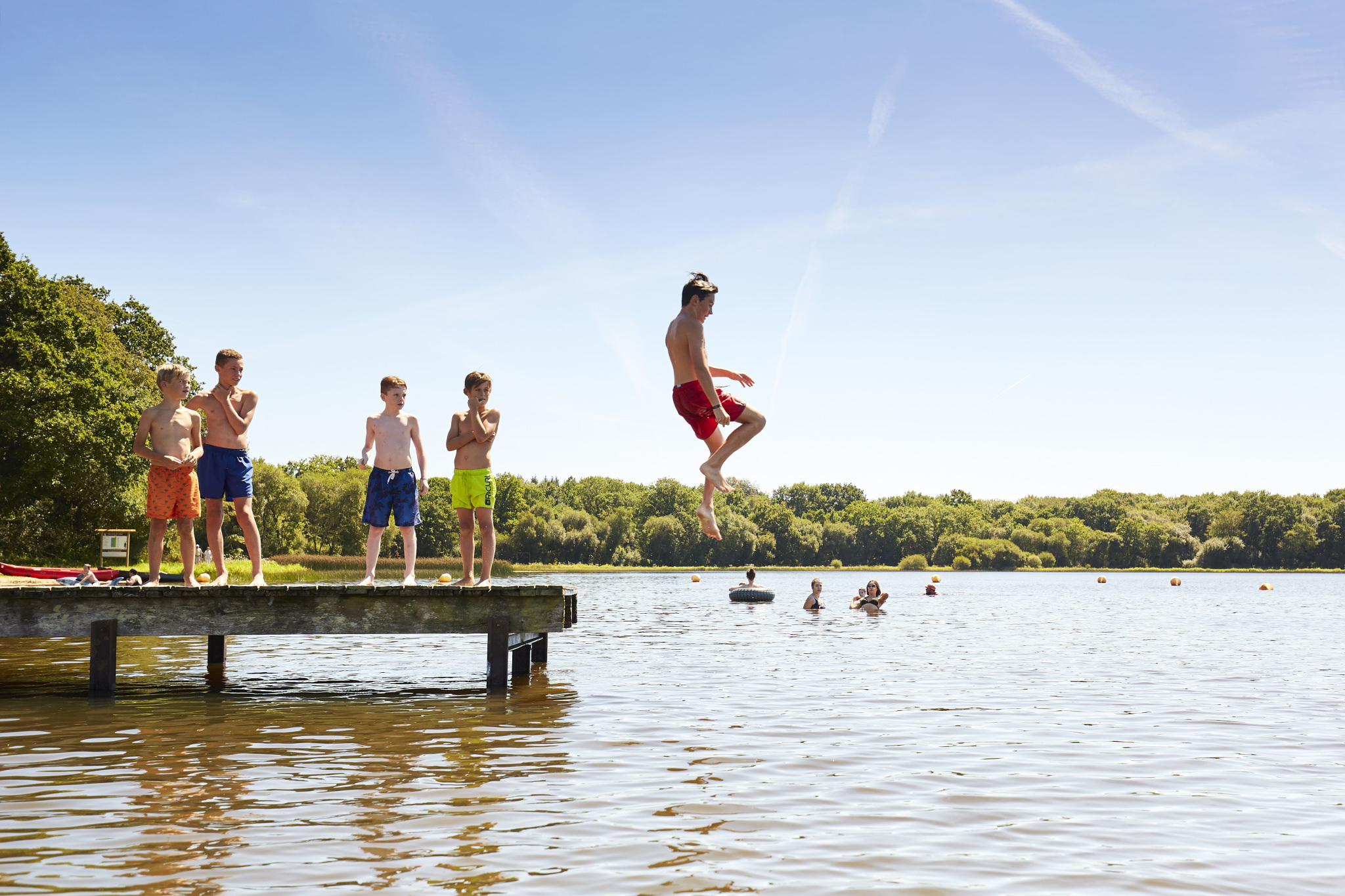 Young people having fun on the banks of Priziac lake